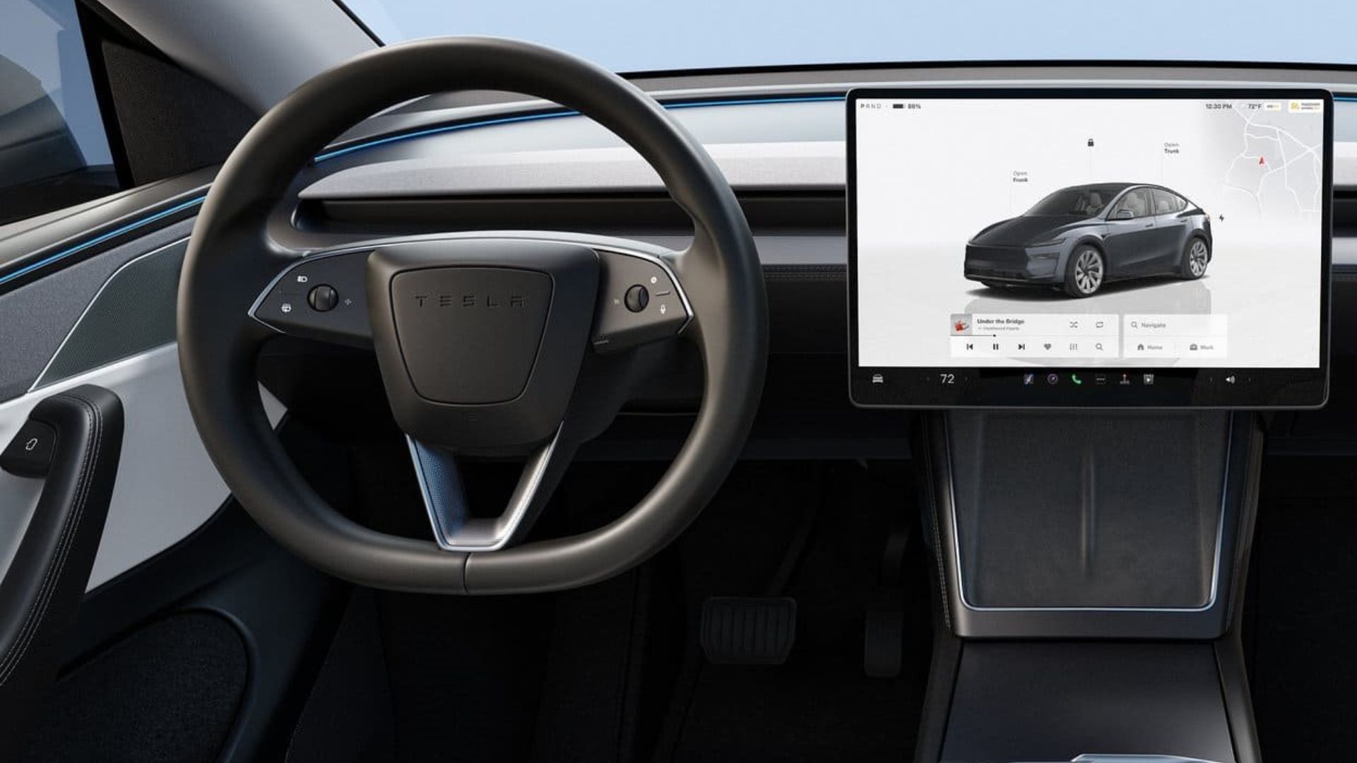 Tesla Model Y prateado em frente a loja da Tesla após redução de preço para US$ 37.990.