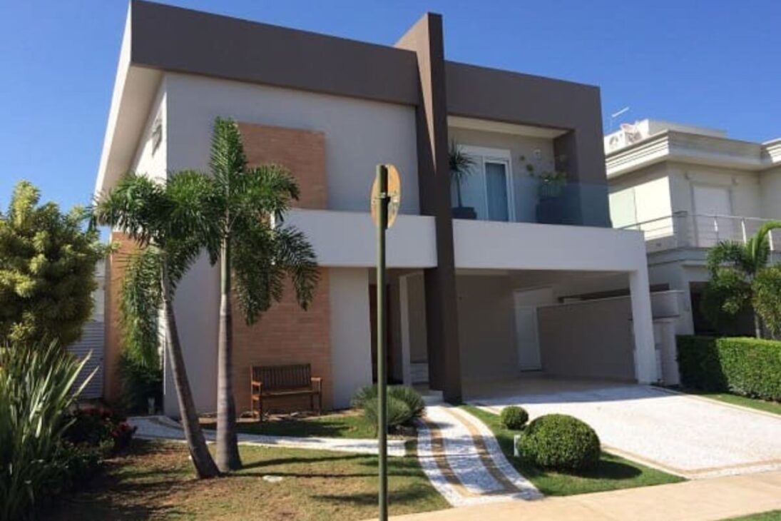 Casas brasileiras modernas com telhados planos, janelas grandes, paredes de cimento e casa em forma de caixa explicam por que esse estilo domina novos bairros no Brasil.